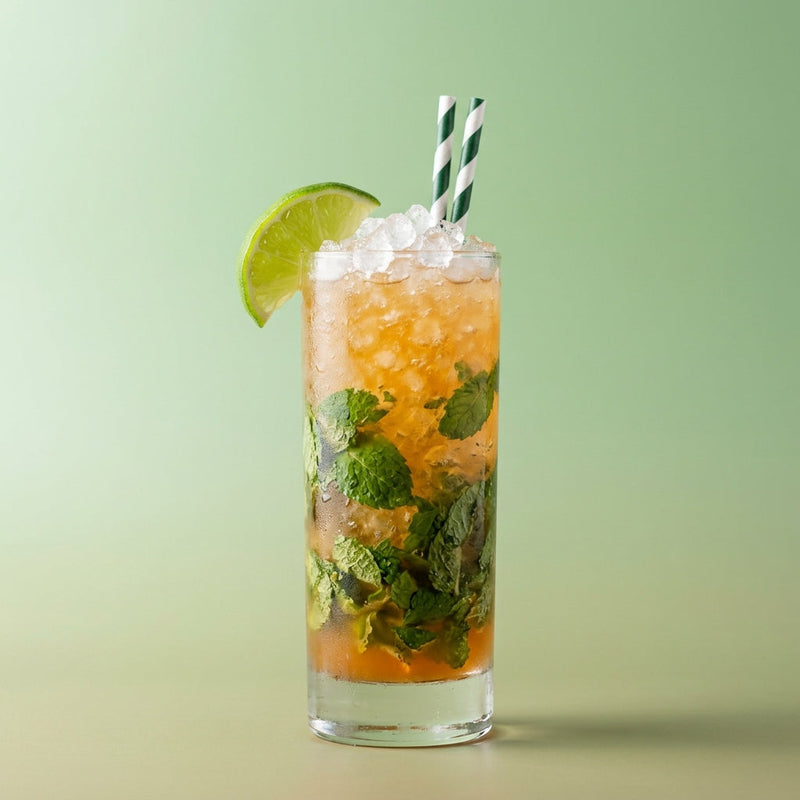 A photo of the Grand Marnier Frost cocktail containing Grand Marnier, Freshly squeezed lime juice, Mint leaves in a Collins.