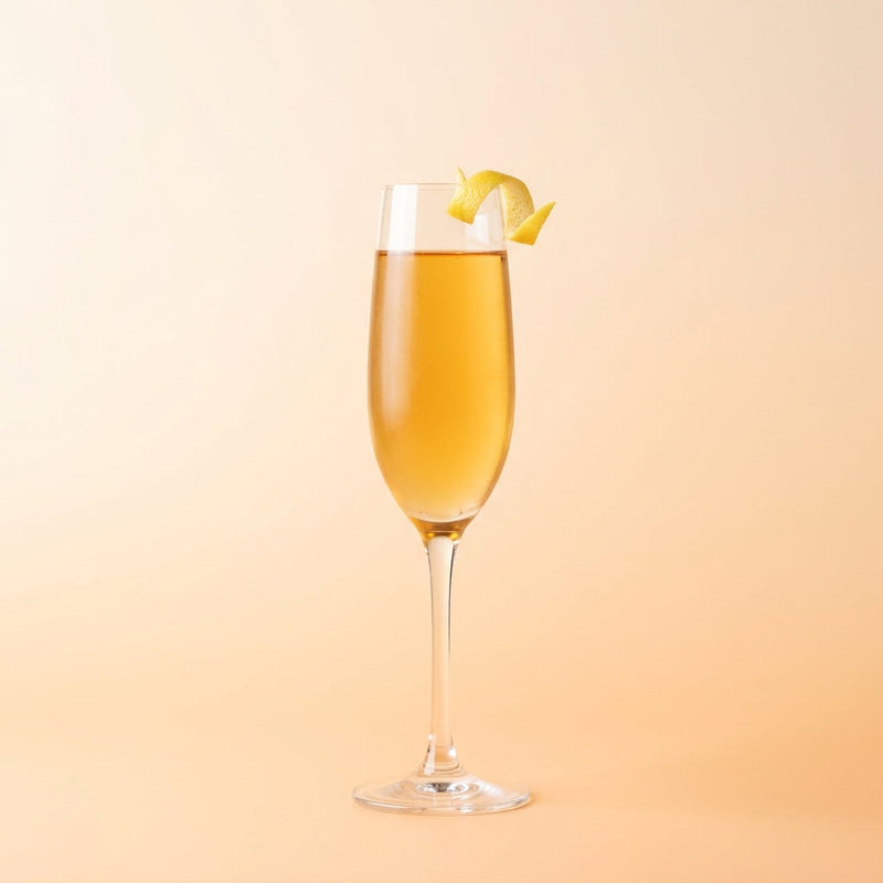 A photo of the Parisian Sidecar Royale cocktail containing Hennessy V.S. Cognac, Giffard Triple Sec, Suze Aperitif, Pernod Absinthe in a Flute.