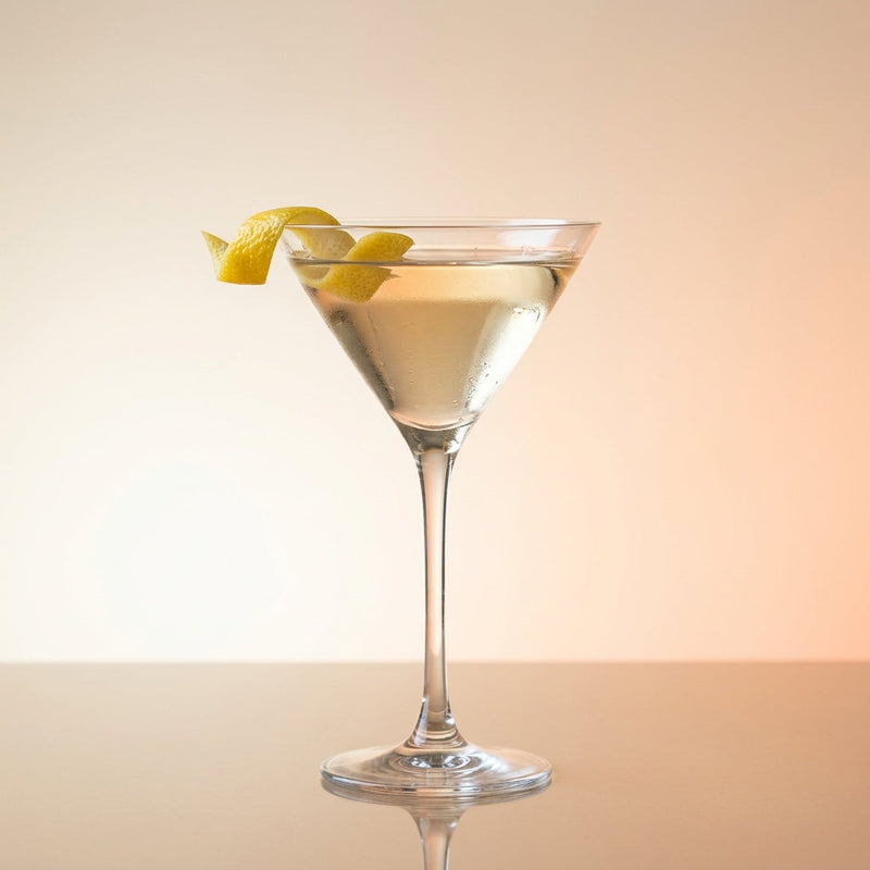 A photo of the Tartan Martini cocktail containing Noilly Prat Dry Vermouth, Giffard Triple Sec, Peychaud's Bitters, Compass Box Great King Street Artist's Blend Scotch in a Martini.