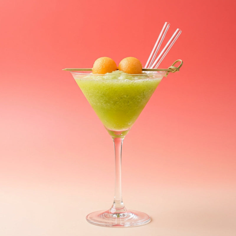 A photo of the Melon Rum Blizzard cocktail containing Cantaloupe melon, Planteray 3 Stars White Rum, MIDORI Melon Liqueur, Freshly squeezed lime juice in a Martini.