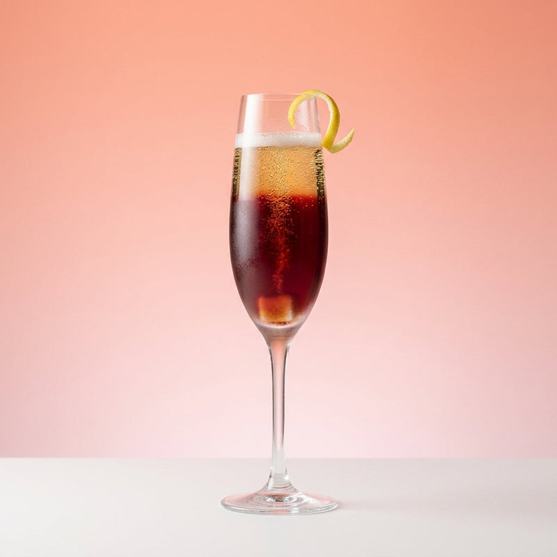 A photo of the Alfonso cocktail containing Caster sugar, Angostura Aromatic Bitters, Dubonnet Rouge, Perrier Jouet Grand Brut Champagne in a Flute.