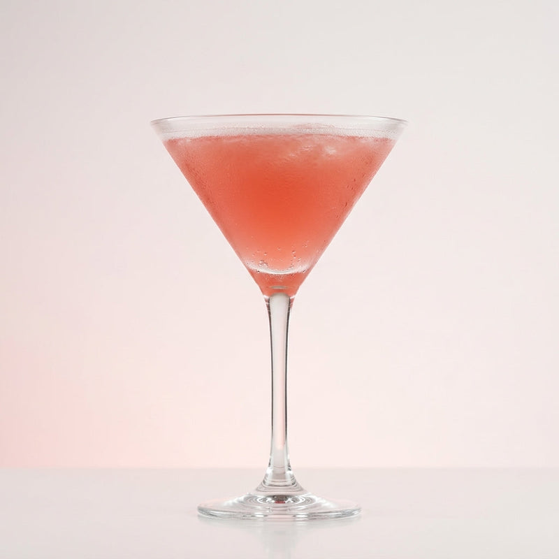 A photo of the The Green Fog Martini cocktail containing Pernod Absinthe, Beefeater London Dry Gin, Hayman's Sloe Gin, Freshly squeezed pink grapefruit juice in a Martini.