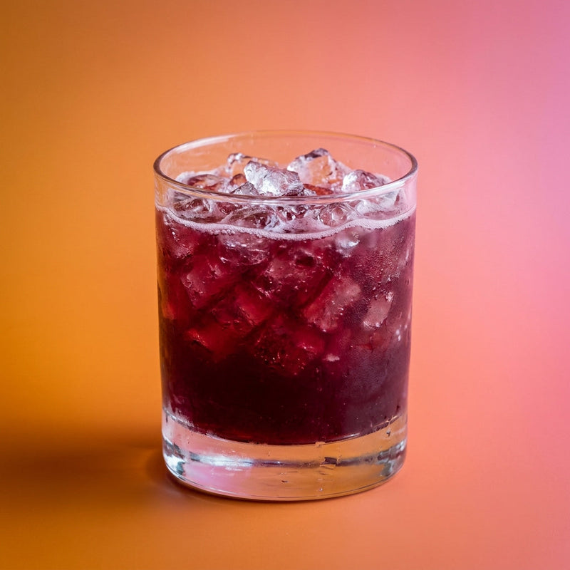 A photo of the Jamaican Blackcurrant Crush cocktail containing Wray & Nephew White Overproof Rum, LEJAY LAGOUTE Crème de Cassis, Freshly squeezed lime juice, Giffard Sugar Cane Syrup (Sirop Sucre de Canne) in a Old-Fashioned.