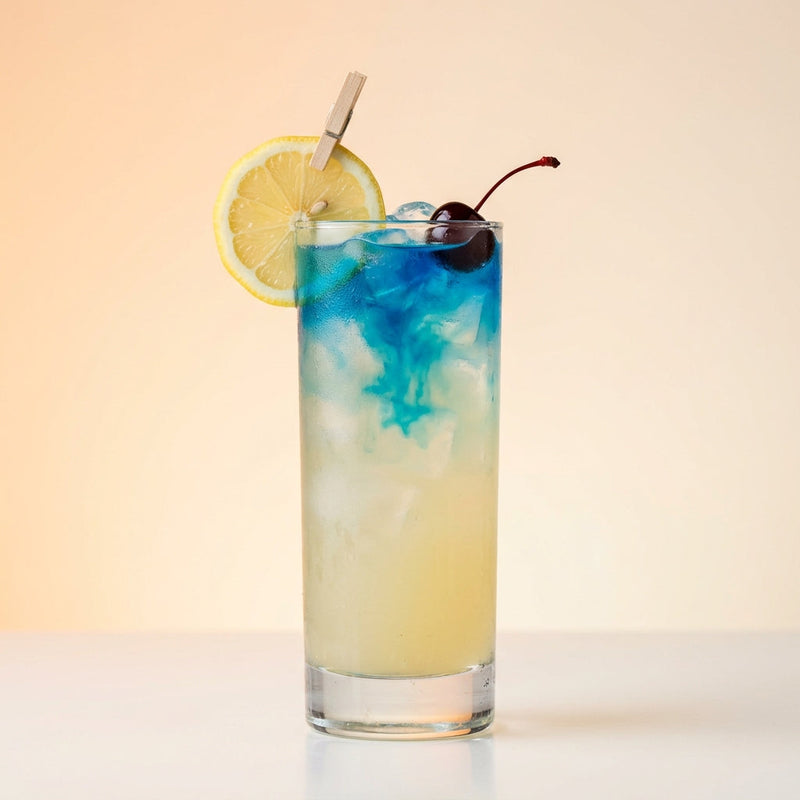 A photo of the Azure Vodka Collins cocktail containing Ketel One Vodka, Freshly squeezed lemon juice, Giffard Sugar Cane Syrup (Sirop Sucre de Canne), Lemon-lime soda, Giffard Blue Curaçao in a Collins.
