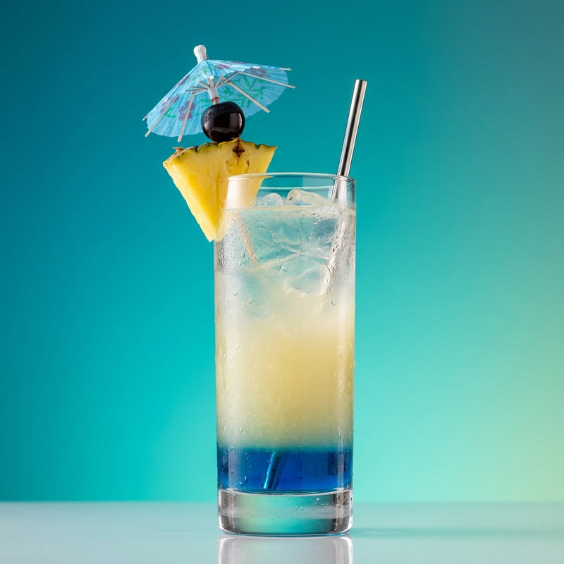 A photo of the Blue Hawaii cocktail containing Giffard Blue Curaçao, Fresh pressed pineapple juice, Freshly squeezed lime juice, Giffard Sugar Cane Syrup (Sirop Sucre de Canne), Planteray 3 Stars White Rum in a Collins.