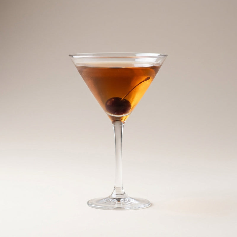 A photo of the Boulevard cocktail containing Savage & Cooke Cask Finished Bourbon, Grand Marnier, Noilly Prat Dry Vermouth, Angostura Orange Bitters in a Martini.