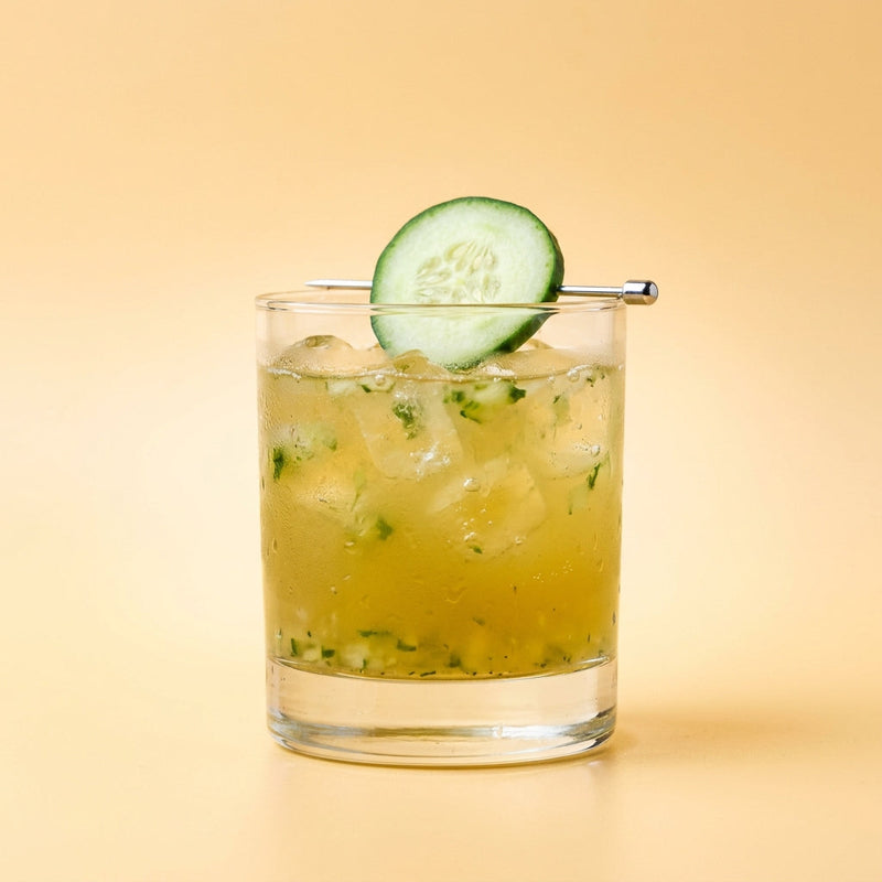 A photo of the The Celtic Garden cocktail containing English cucumber peeled, Jameson Irish Whiskey, St-Germain Elderflower Liqueur, Freshly squeezed lemon juice, Giffard Sugar Cane Syrup (Sirop Sucre de Canne) in a Old-Fashioned.