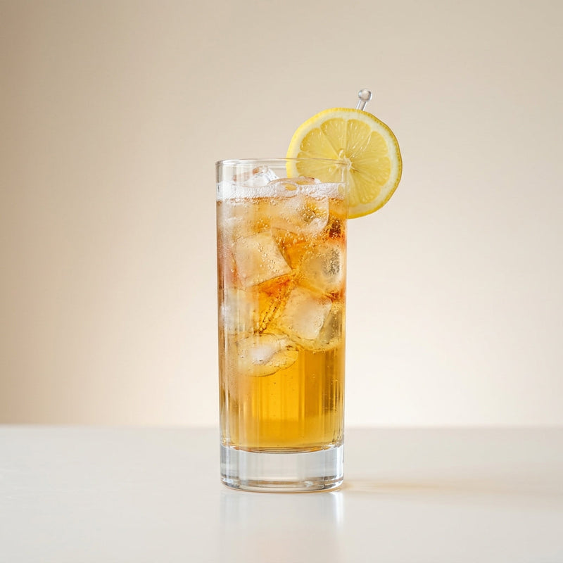 A photo of the Jamaican Rusty Fizz cocktail containing Appleton Estate 8 Year Old Reserve Rum, Drambuie Liqueur, Freshly squeezed lemon juice, Peychaud's Bitters, Club soda in a Collins.