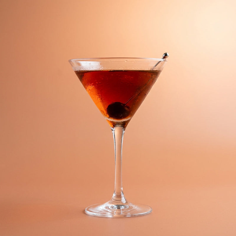 A photo of the Cherry Manhattan Royale cocktail containing Savage & Cooke Cask Finished Bourbon, Giffard Triple Sec, Heering Cherry Liqueur, Martini & Rossi Rosso Sweet Vermouth in a Martini.