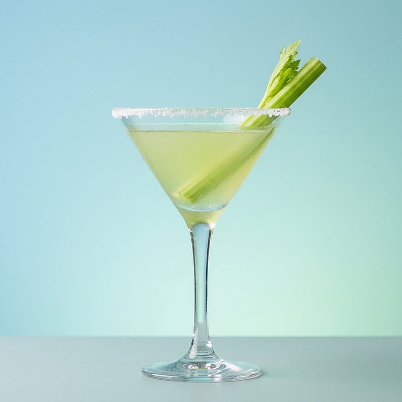 A photo of the Salty Celery Martini cocktail containing Ketel One Vodka, Giffard Sugar Cane Syrup (Sirop Sucre de Canne), Freshly extracted celery juice in a Martini.