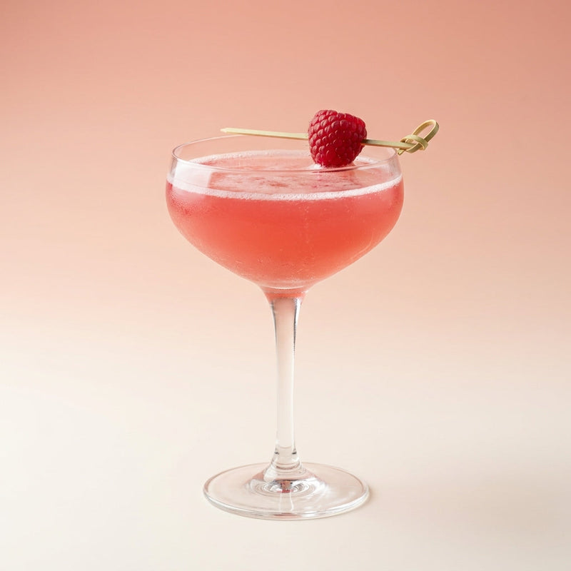 A photo of the The Blushing Botanist cocktail containing Hendrick's Gin, Chambord Liqueur, Freshly squeezed lime juice, Giffard Sugar Cane Syrup (Sirop Sucre de Canne), Pickled gherkin brine/vinegar in a Coupe.