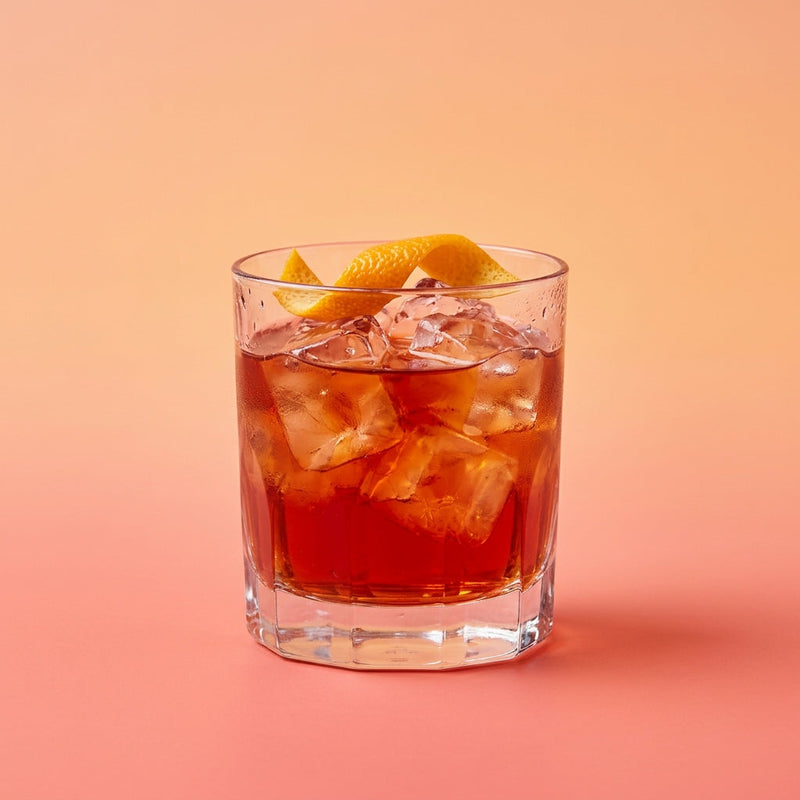 A photo of the Mezcal Negroni cocktail containing Del Maguey Vida Mezcal, Campari Aperitivo, Martini & Rossi Rosso Sweet Vermouth in a Old-Fashioned.