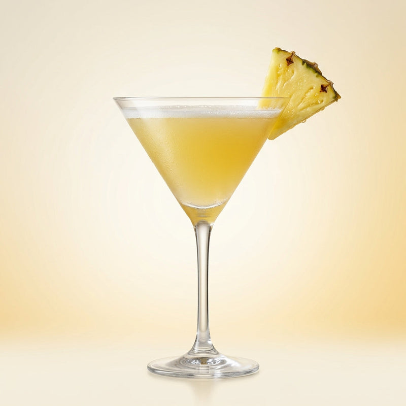 A photo of the Pineapple Martini cocktail containing Ketel One Vodka, Fresh pressed pineapple juice, Freshly squeezed lime juice, Giffard Sugar Cane Syrup (Sirop Sucre de Canne) in a Martini.