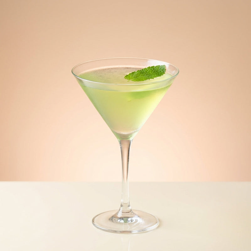 A photo of the Minty White Daiquiri cocktail containing Planteray 3 Stars White Rum, Giffard Triple Sec, Tempus Fugit Crème De Menthe, Freshly squeezed lime juice, Giffard Sugar Cane Syrup (Sirop Sucre de Canne) in a Martini.