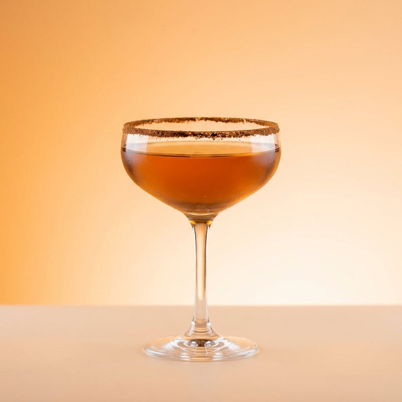 A photo of the Parisian Manhattan cocktail containing Hennessy V.S. Cognac, Martini & Rossi Rosso Sweet Vermouth, St-Germain Elderflower Liqueur in a Coupe.
