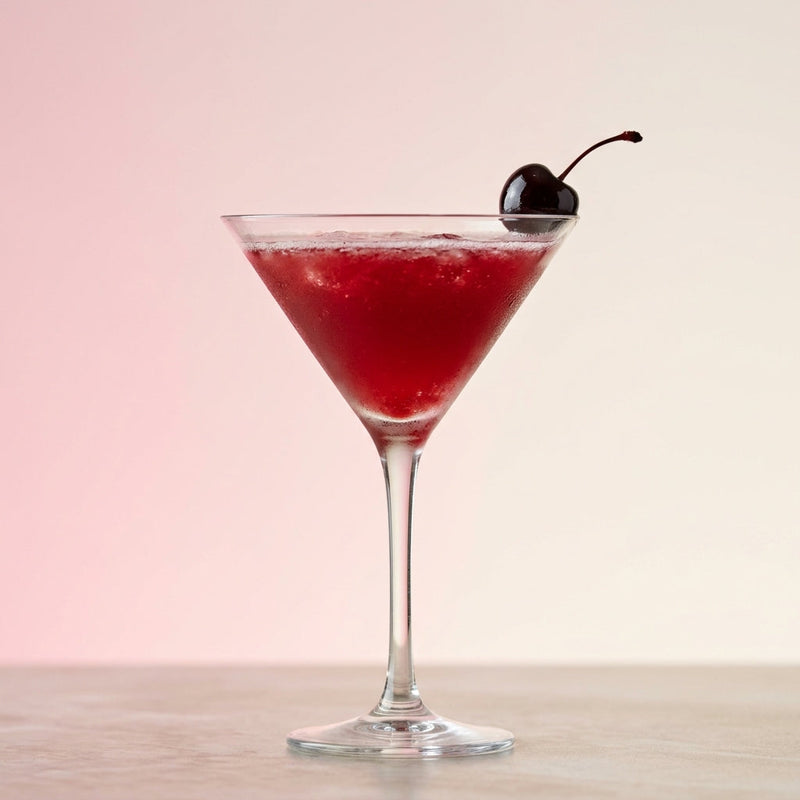 A photo of the The Purple Martini cocktail containing Beefeater London Dry Gin, Freshly squeezed lemon juice, Giffard Sugar Cane Syrup (Sirop Sucre de Canne), LEJAY LAGOUTE Crème de Cassis in a Martini.