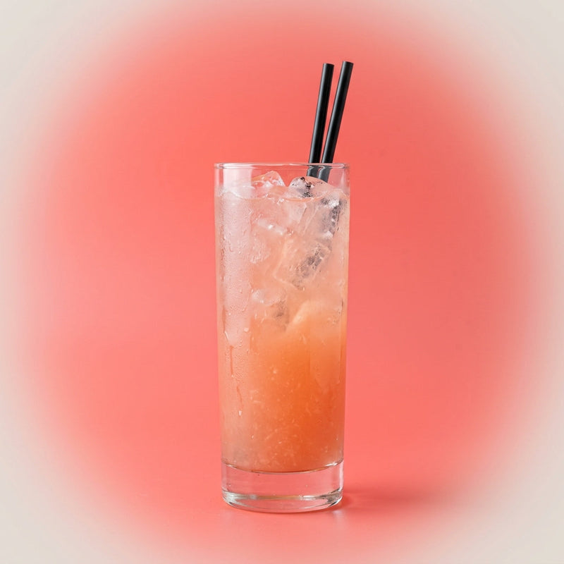 A photo of the Rum & Ruby Fizz cocktail containing Flor de Caña 4 Year Old Añejo Oro Rum, Freshly squeezed pink grapefruit juice in a Collins.