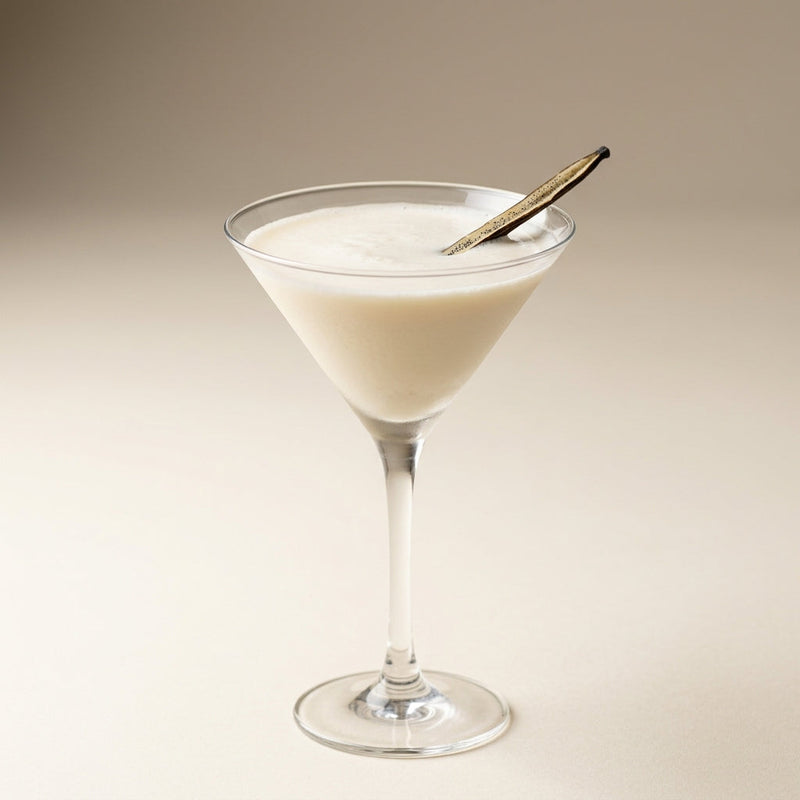 A photo of the The Vanilla Bitter Martini cocktail containing Vanilla pod, Baldoria Bitter Vermouth, Single cream / half-and-half, Giffard Sugar Cane Syrup (Sirop Sucre de Canne) in a Martini.
