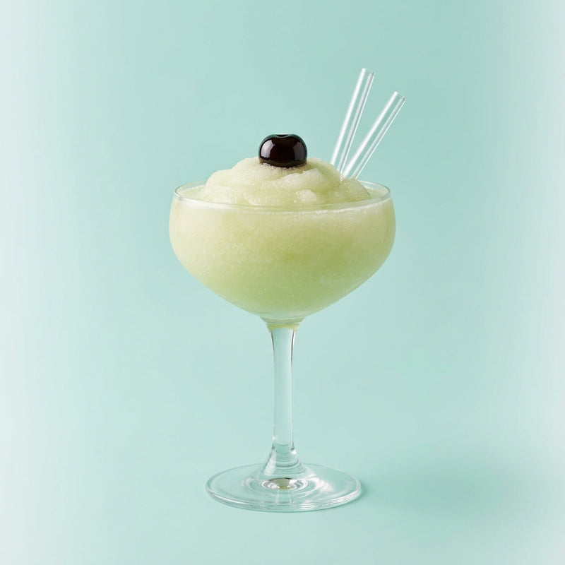 A photo of the Frozen Margarita cocktail containing Milagro Reposado Tequila, Giffard Triple Sec, Freshly squeezed lime juice, Giffard Sugar Cane Syrup (Sirop Sucre de Canne) in a Coupe.