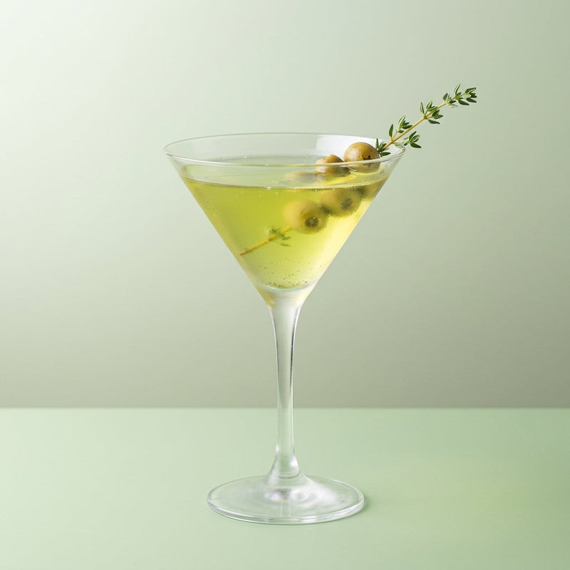A photo of the The Herbal Verdict cocktail containing Lemon thyme (remove stalks), Beefeater London Dry Gin, Green Chartreuse, Giffard Sugar Cane Syrup (Sirop Sucre de Canne) in a Martini.