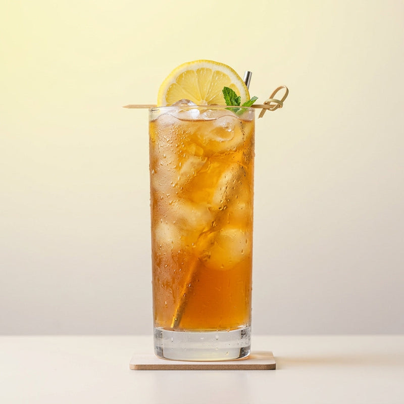 A photo of the The Ketel Cooler cocktail containing Ketel One Vodka, Freshly squeezed lemon juice, Giffard Sugar Cane Syrup (Sirop Sucre de Canne), Freshly brewed cold black English breakfast tea in a Collins.