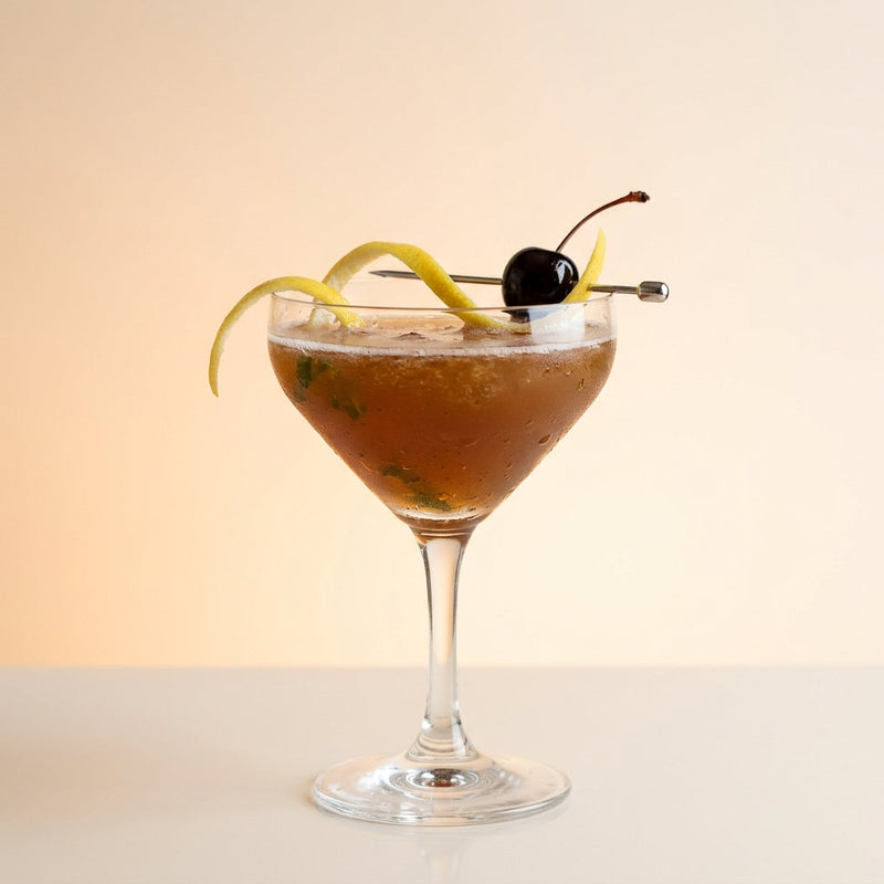 A photo of the A.B.C. Cocktail cocktail containing Mint leaves, Graham's 10 Year Old Aged Tawny Port, Hennessy V.S. Cognac, Luxardo Maraschino Liqueur, Giffard Sugar Cane Syrup (Sirop Sucre de Canne) in a Martini (Small).