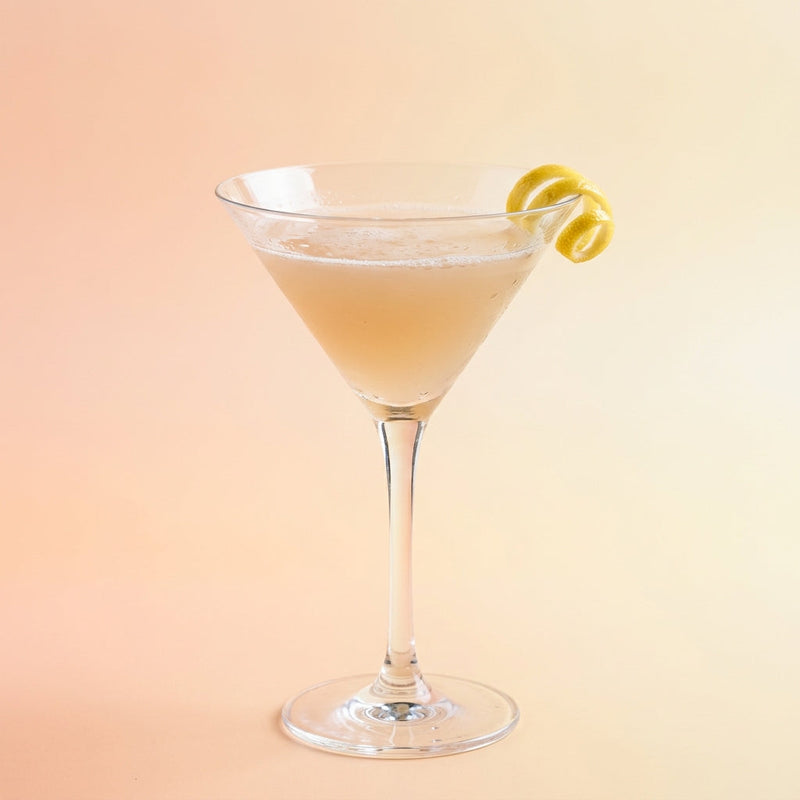 A photo of the Fine & Dandy cocktail containing Beefeater London Dry Gin, Giffard Triple Sec, Freshly squeezed lemon juice, Giffard Sugar Cane Syrup (Sirop Sucre de Canne), Chilled water (reduce if wet ice), Angostura Aromatic Bitters in a Martini.