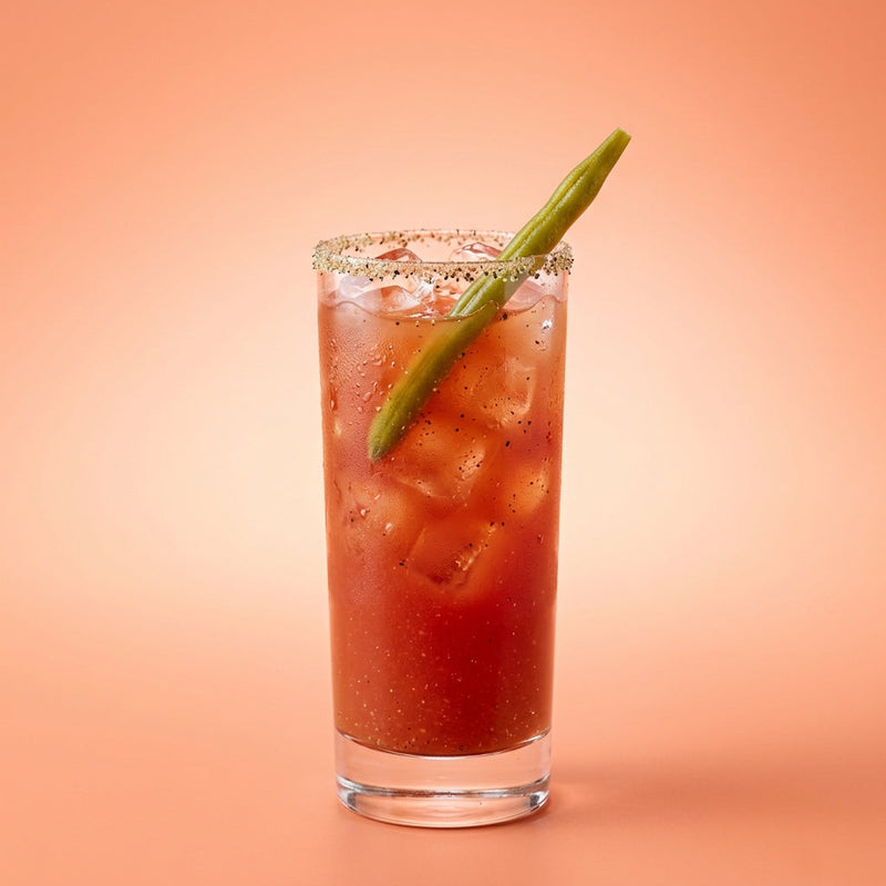 A photo of the Bloody Caesar cocktail containing Ketel One Vodka, Mott's Clamato juice, Freshly squeezed lemon juice, Hot pepper sauce, Worcestershire sauce, Celery salt, Black pepper in a Collins.