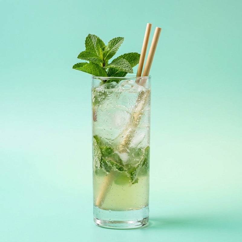 A photo of the Chartreuse Mint Fizz cocktail containing Mint leaves, Green Chartreuse, Giffard Sugar Cane Syrup (Sirop Sucre de Canne), Freshly squeezed lime juice, Club soda in a Collins.