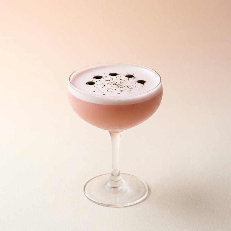 A photo of the Strawberry Silk Sour cocktail containing Small ripe strawberries (hulled), Ketel One Vodka, Freshly squeezed lemon juice, Honey water (3 honey to 1 water), Fee Brothers Fee Foam Egg White Alternative in a Coupe.