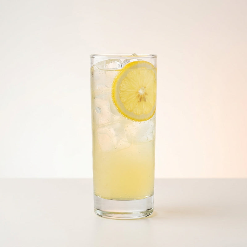 A photo of the Brass Monkey cocktail containing Planteray 3 Stars White Rum, Ketel One Vodka, Freshly squeezed lemon juice, Giffard Sugar Cane Syrup (Sirop Sucre de Canne) in a Collins.