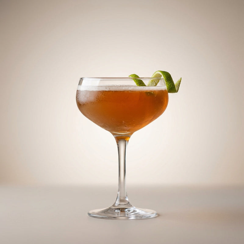 A photo of the Lion's Tail cocktail containing Savage & Cooke Cask Finished Bourbon, St. Elizabeth Allspice Dram, Freshly squeezed lime juice, Giffard Sugar Cane Syrup (Sirop Sucre de Canne), Angostura Aromatic Bitters in a Coupe.