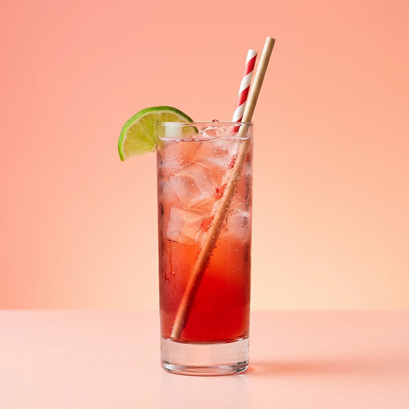 A photo of the Crimson Lemonade Fizz cocktail containing Pressed apple juice, Freshly squeezed lime juice, Liber & Co. Real Grenadine, Lemon-lime soda in a Collins.