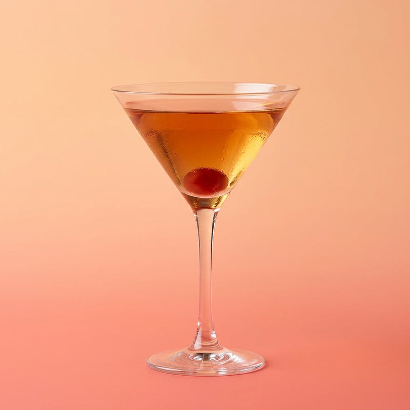 A photo of the Trinity cocktail containing Compass Box Great King Street Artist's Blend Scotch, Giffard Abricot Du Roussillon, Noilly Prat Dry Vermouth, Tempus Fugit Crème De Menthe, Angostura Orange Bitters in a Martini.