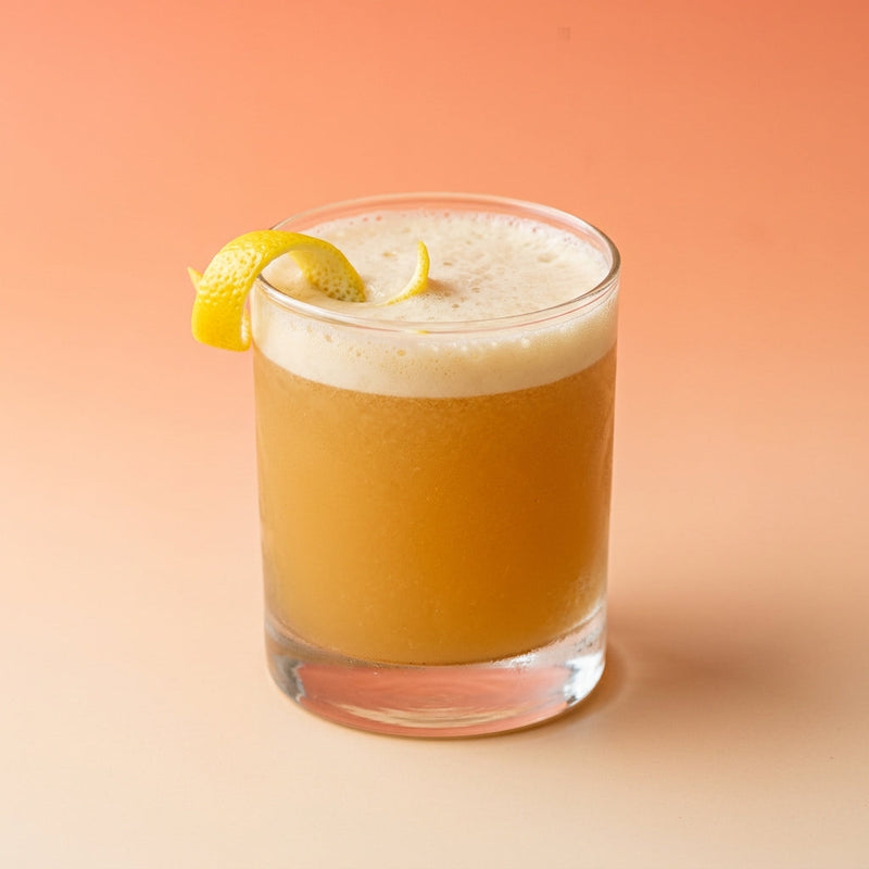 A photo of the Jersey Sour cocktail containing Laird's Straight Apple Brandy 100 Proof Bottled In Bond, Freshly squeezed lemon juice, Giffard Sugar Cane Syrup (Sirop Sucre de Canne), Fee Brothers Fee Foam Egg White Alternative in a Old-Fashioned.