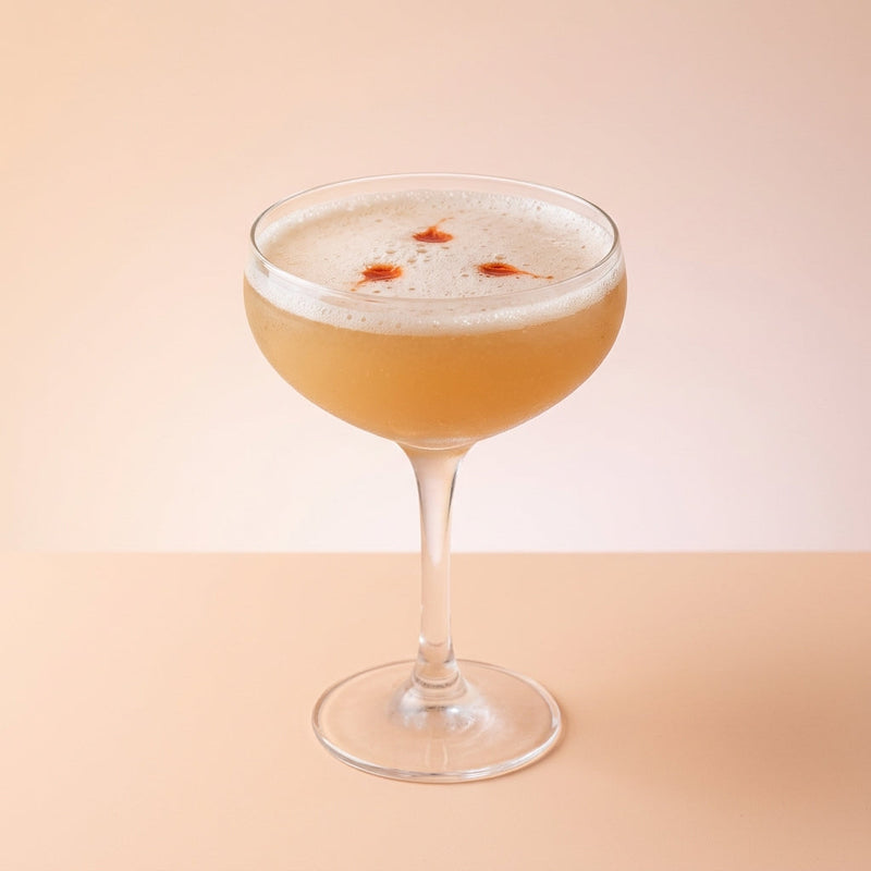 A photo of the Golden Kina Sour cocktail containing Tempus Fugit Kina L'Aero d'Or, Beefeater London Dry Gin, Freshly squeezed lemon juice, Giffard Orgeat Syrup, Peychaud's Bitters in a Coupe.