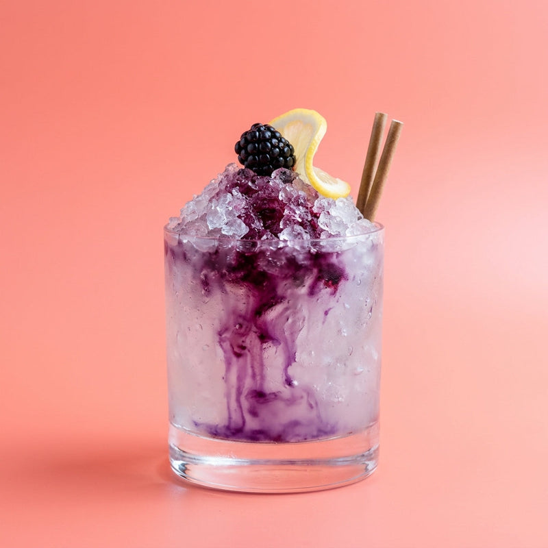 A photo of the Bramble cocktail containing Beefeater London Dry Gin, Freshly squeezed lemon juice, Giffard Sugar Cane Syrup (Sirop Sucre de Canne), Combier Crème de Mûre Blackberry Liqueur in a Old-Fashioned.