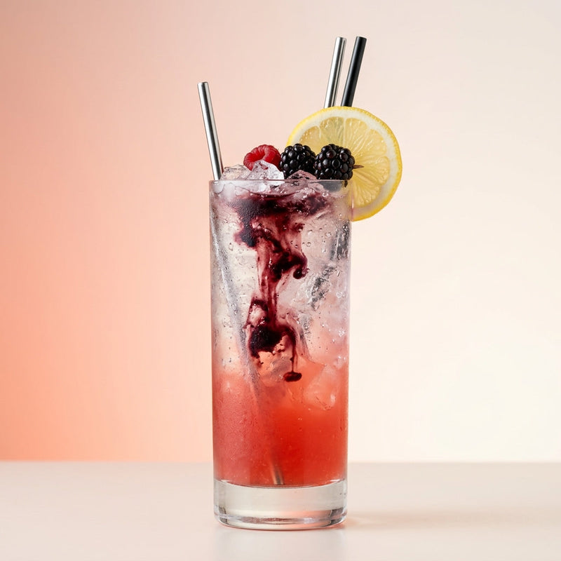 A photo of the Berry Bramble Sling cocktail containing Beefeater London Dry Gin, Hayman's Sloe Gin, Freshly squeezed lemon juice, Giffard Sugar Cane Syrup (Sirop Sucre de Canne), Club soda, Combier Crème de Mûre Blackberry Liqueur in a Sling.