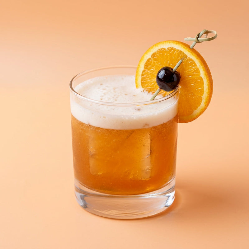 A photo of the Frisco Sour cocktail containing Savage & Cooke Cask Finished Bourbon, Bénédictine D.O.M. Liqueur, Freshly squeezed lemon juice, Giffard Sugar Cane Syrup (Sirop Sucre de Canne), Fee Brothers Fee Foam Egg White Alternative in a Old-Fashioned.