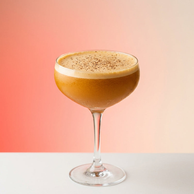 A photo of the Cognac & Bramble Mule Fizz cocktail containing Hennessy V.S. Cognac, Combier Crème de Mûre Blackberry Liqueur, Barrow's Intense Ginger Liqueur, Egg yolk in a Coupe.