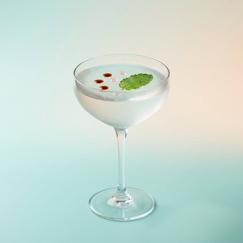 A photo of the The Cucumber Rose Gimlet cocktail containing English cucumber peeled, Mint leaves, Salt, Beefeater London Dry Gin, Freshly squeezed lime juice, Giffard Sugar Cane Syrup (Sirop Sucre de Canne) in a Coupe.