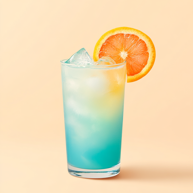 A photo of the Lychee Lagoon cocktail containing Giffard Lichi-Li Liqueur, Giffard Blue Curaçao, Freshly squeezed pink grapefruit juice in a Collins.
