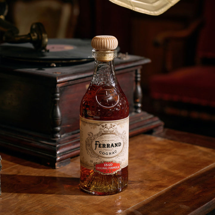 Bottle of Ferrand 1840 Cognac Original Formula on a table.