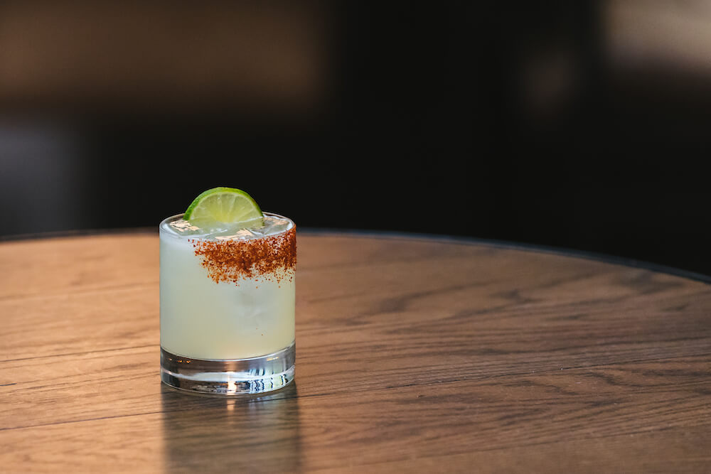 A margarita garnished with a lime wheel and a taijin rim, made with Giffard Triple Sec.