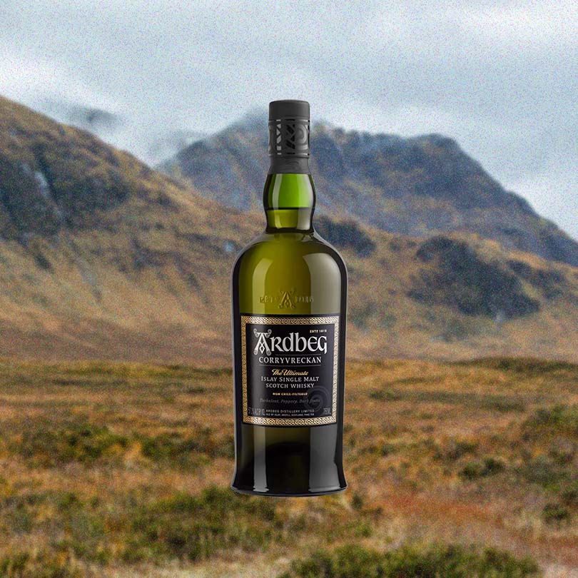 Bottle of Ardbeg 'Corryvreckan' Islay Single Malt Scotch Whisky over backdrop image of moutains.