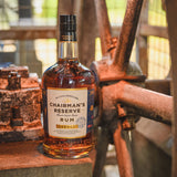 Bottle of Chairman's Reserve Rum on a rustic metal surface