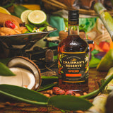 Chairman's Reserve spiced rum bottle on a tropical-themed background with fruits and leaves.