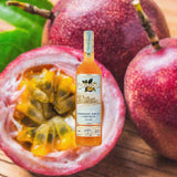 Bottle of Chinola Passionfruit Liqueur over backdrop image of passion fruits.