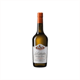 A yellow-hued glass bottle with an orange foil covering.  It looks not dissimilar to a wine bottle. The label is similar too, it reads: Le Calvados de Christian Drouin.  The label has lion illustration at the top and the whole thing is set against what looks like the backdrop of a great french manor house.