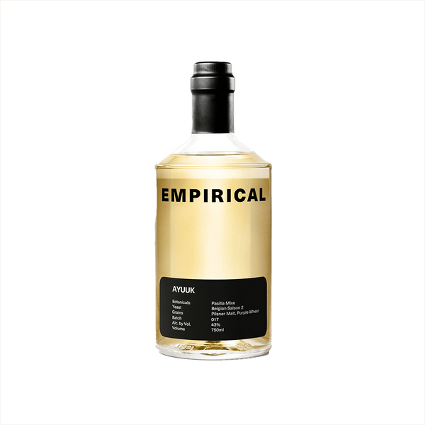 A refined looking minimalistic yellow bottle with the word EMPIRICAL on top in large black sans serif font. Ayuuk is on a black label at the bottom, including a list of ingredients: Botanicals - Pasilla Mixe; Yeast - Belgian Saison 2; Grains - Pilsner Malt, Purple Wheat